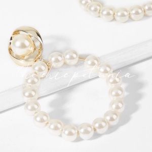 The Chic Petunia Jewelry - Pearl hoop drop earrings. The Chic Petunia Jewelry - Pearl hoop drop earrings.